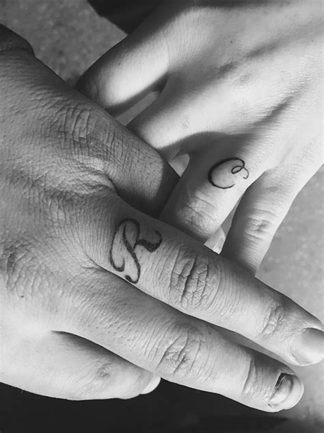 tattoo on ring finger|initial tattoo on ring finger.